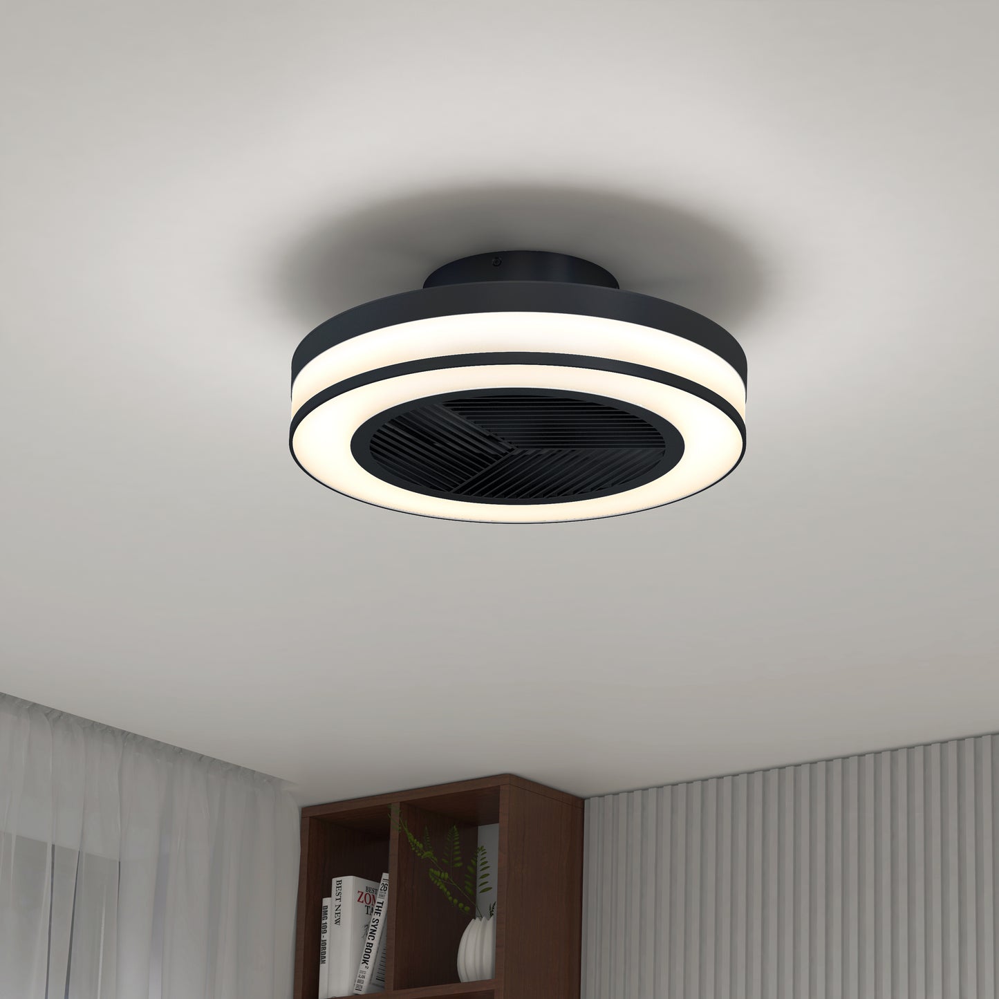 The Artika Elton 19.4 in. LED modern ceiling fan with 3 speeds and remote is mounted on a white ceiling above a room featuring white curtains and a wooden bookshelf.