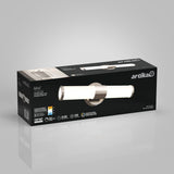 A black rectangular box featuring the Artika Adina LED vanity light, with product image, brand logo, and specifications displayed on the packaging against a light gray background.
