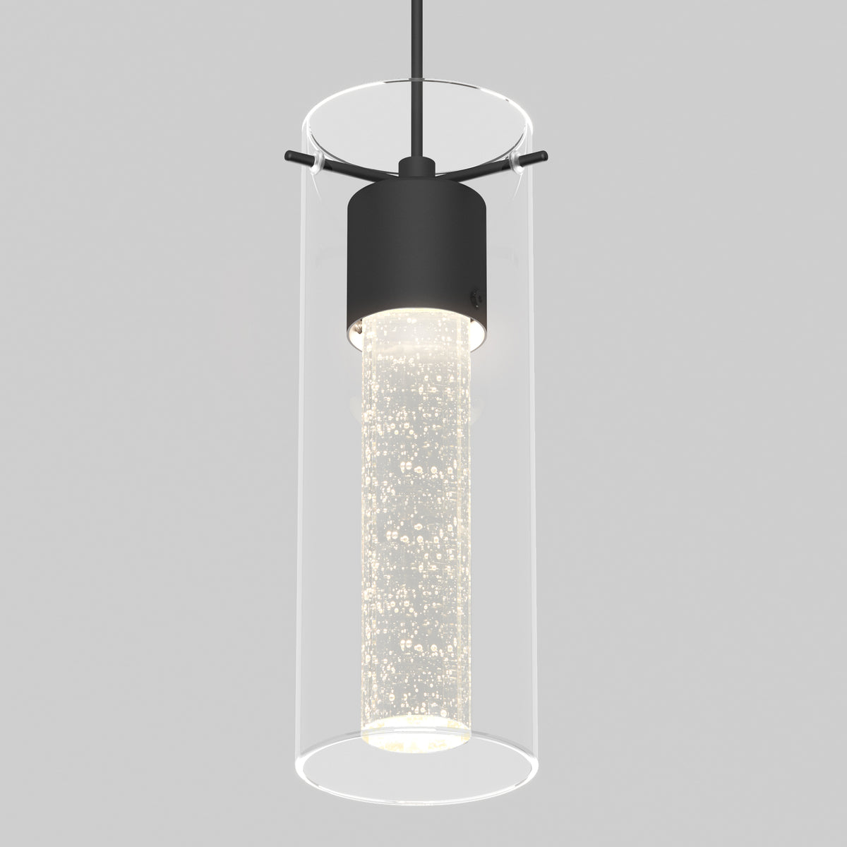 A modern pendant light with a cylindrical glass shade and a black metal fixture, featuring a sparkling, bubble-filled inner tube illuminated from within. The background is plain light gray.