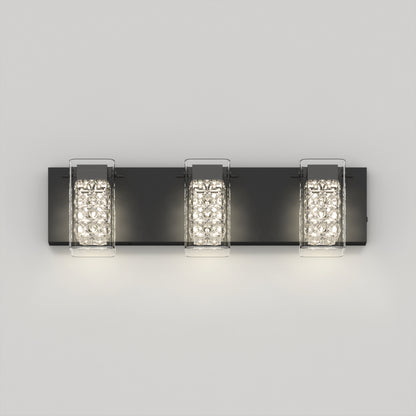 The Artika Crystal Cube LED bathroom vanity light 5 CCT features three crystal-enclosed lights on a sleek black base, wall-mounted and illuminated against a plain white background.