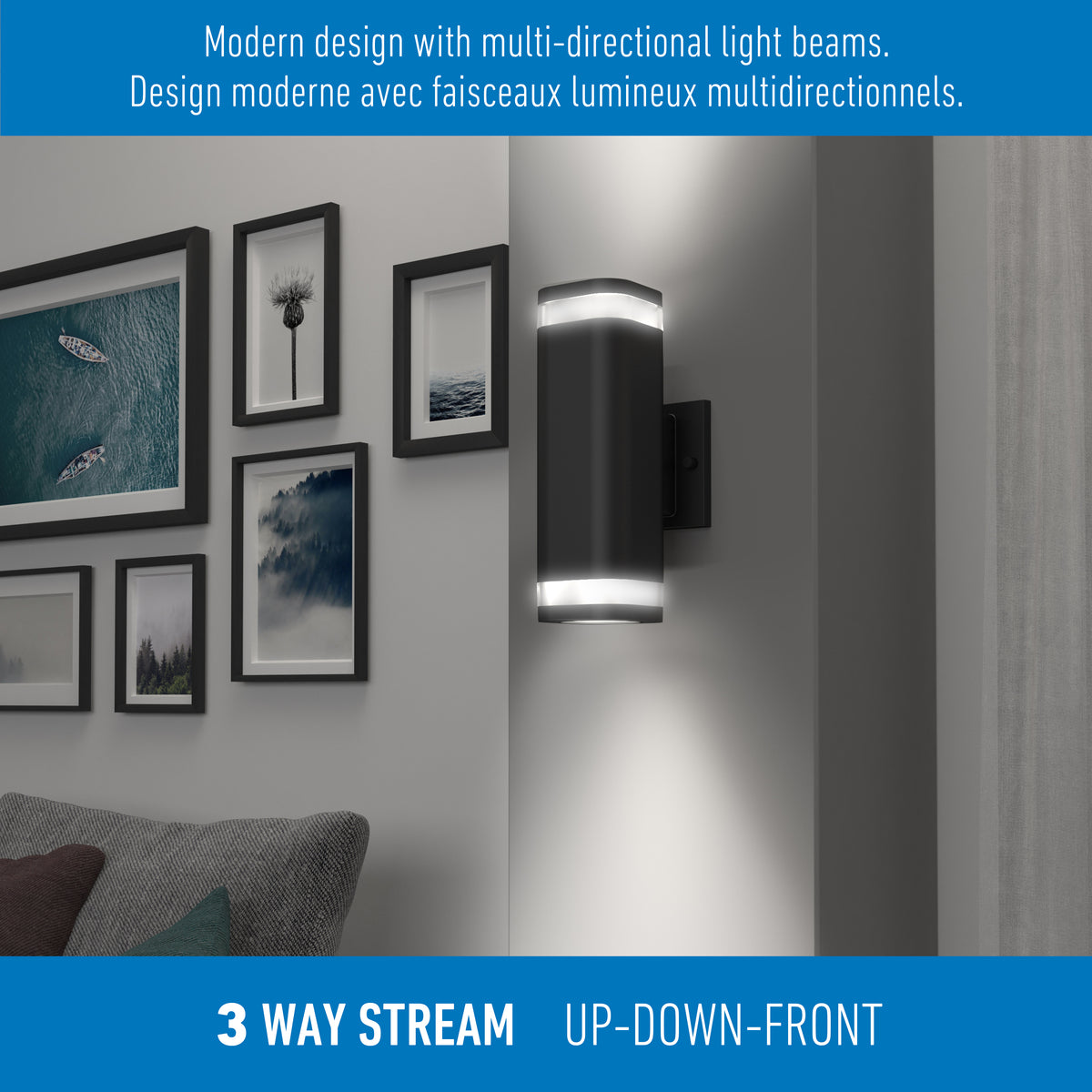 The Artika Stark modern LED indoor-outdoor light with wi-fi features a sleek black design, casting light up, down, and forward to highlight artwork above a gray sofa. Bilingual English and French text describes its multi-directional style.