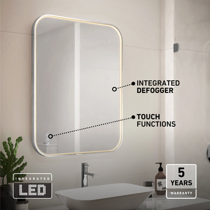 The Artika Royce dimmable LED mirror 3 CCT is a modern rectangular bathroom mirror with integrated LED lighting, touch controls, and defogger labels above a sink. Icons in the corners indicate an integrated LED and a 5-year warranty.