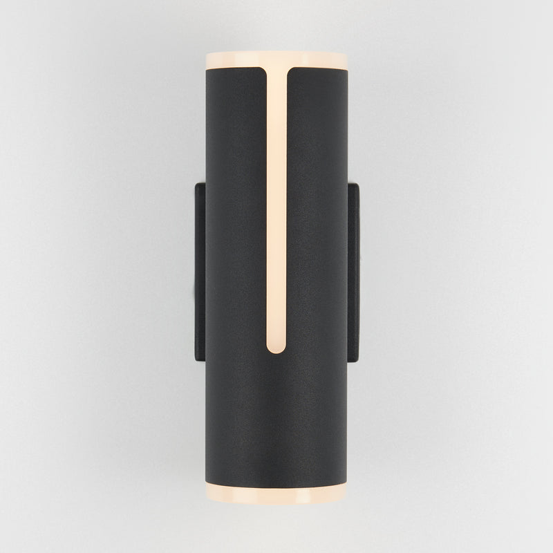 Artika’s Linea modern indoor-outdoor LED wall light features a black cylinder with vertical beige accents, shown on a light gray background.