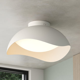 Adara 15 in. (38 cm) Modern LED Flush Mount Ceiling Light 5 CCT in white with a curved, wave-like shade.