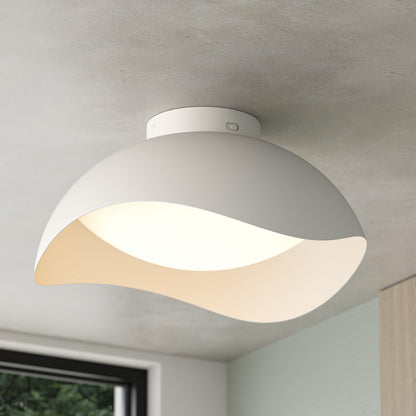 Adara 15 in. (38 cm) Modern LED Flush Mount Ceiling Light 5 CCT in white with a curved, wave-like shade.