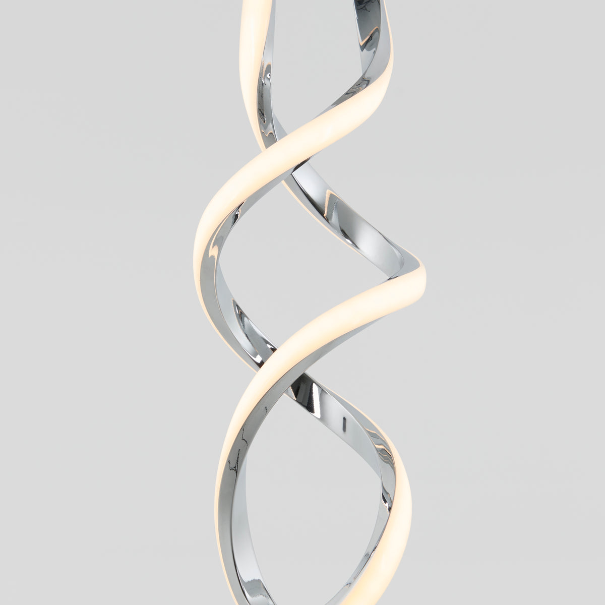 A modern pendant light with a twisted, spiral design featuring chrome and a glowing white LED strip, set against a plain light gray background.