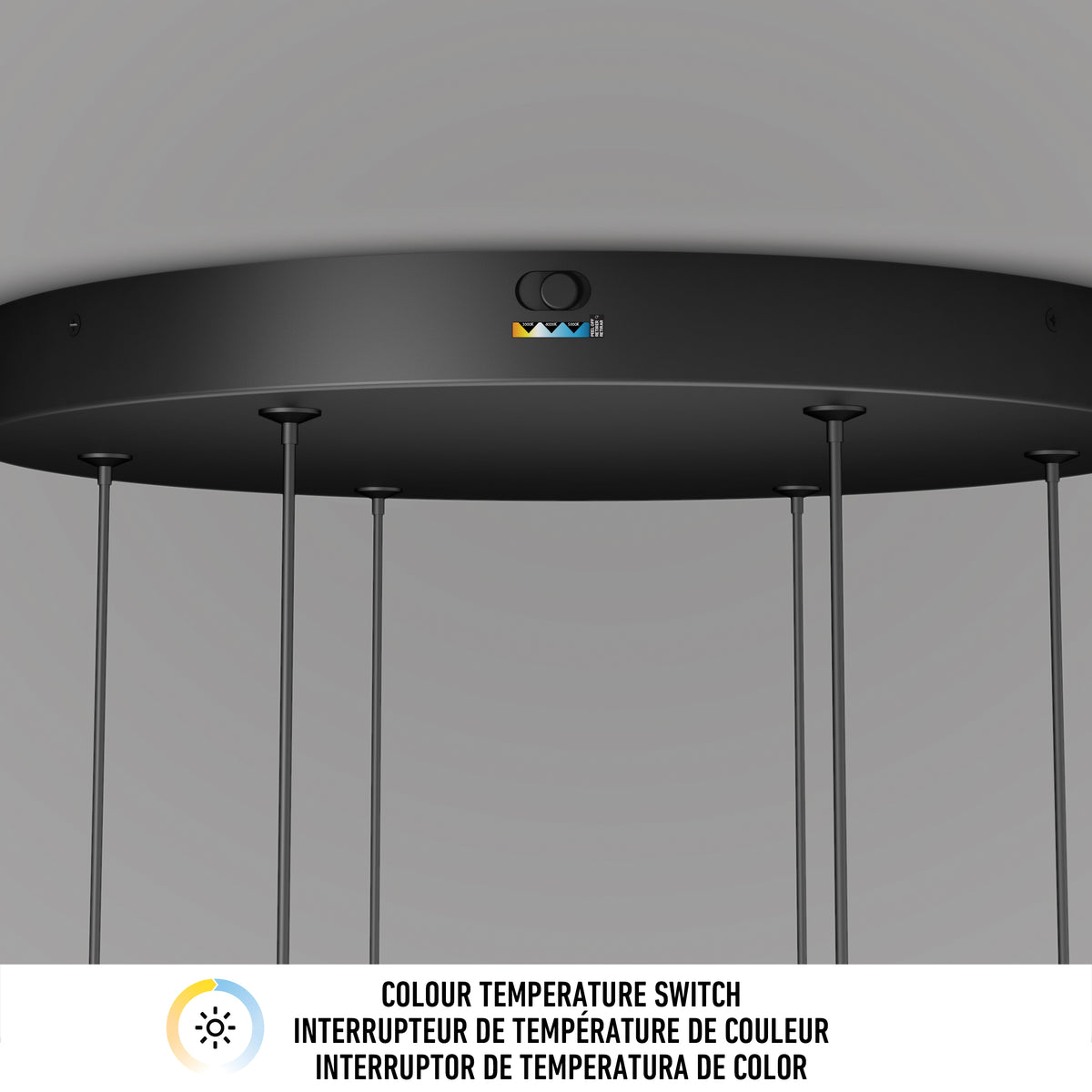 A close-up of a black pendant light fixture with a color temperature switch icon and three colored buttons. Text below reads: Colour Temperature Switch in English, French, and Spanish.