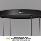 A close-up of a black pendant light fixture with a color temperature switch icon and three colored buttons. Text below reads: Colour Temperature Switch in English, French, and Spanish.