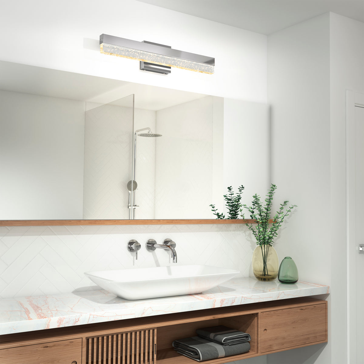 Modern bathroom featuring Artika's Essence Bubble Bar LED vanity light above a large mirror, with a vessel sink and wooden vanity.