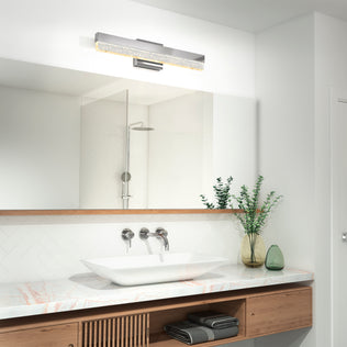 Modern bathroom featuring Artika's Essence Bubble Bar LED vanity light above a large mirror, with a vessel sink and wooden vanity.