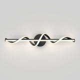 A modern wall sconce with a black circular base and a horizontal, wavy LED light design that twists in a smooth, wave-like pattern against a light gray background.