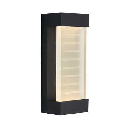 The Artika Percy LED indoor-outdoor wall light features a rectangular black design, frosted glass panel, and horizontal lines for a soft glow.