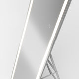 A sleek, modern full-length mirror with LED light strips along its sides, standing on a minimalistic metal frame against a plain white background.