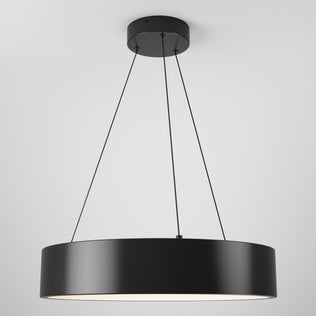 The Artika Aiden LED pendant light features a modern black circular design with thin suspension wires, hanging from a white ceiling and casting soft, diffused light from below.