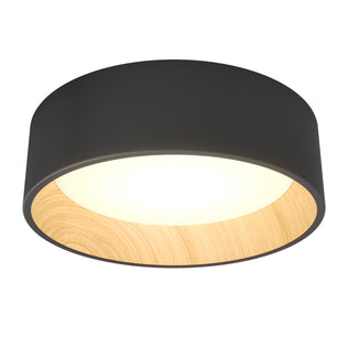 The Artika Alton LED flush mount features a modern design with a black outer rim, wood accent, and round glowing center—an elegant lighting choice.