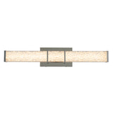 A modern wall-mounted LED light fixture with a rectangular, brushed metal base and a long, horizontal frosted glass bar featuring a textured, crystal-like design, illuminated from within.