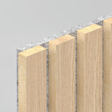 Close-up view of a wall panel featuring alternating vertical light wood slats and gray textured material, creating a modern, layered design against a plain light background.