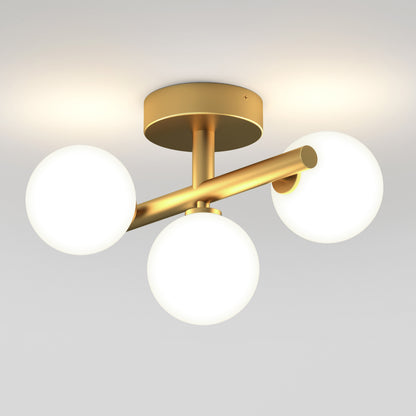 The Artika Bloom modern mid-century LED flush mount light features a gold base and three frosted glass globe bulbs in a triangular design, making it an elegant ceiling fixture for any space.