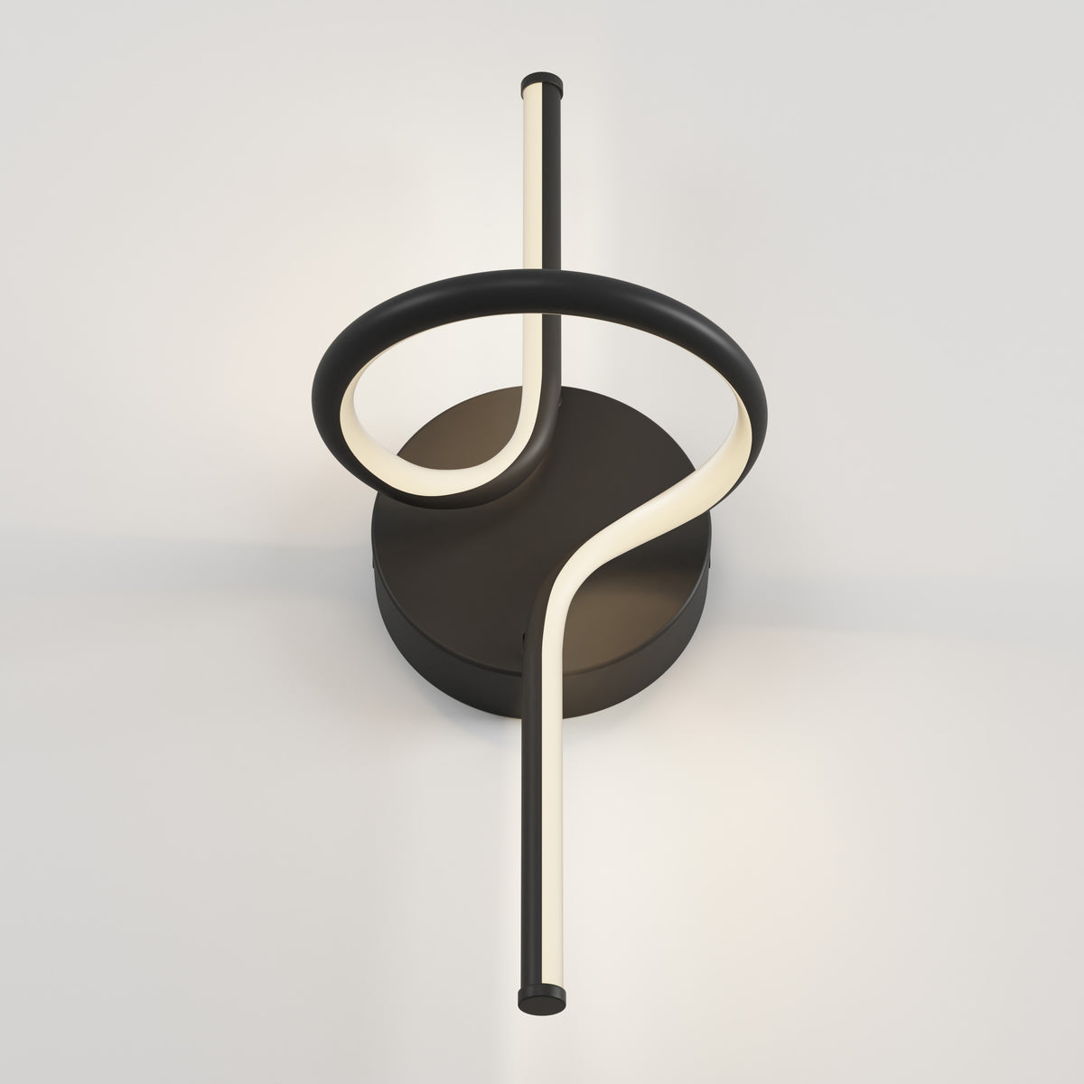 The Swirl LED Sconce by Artika features a circular black base and a looping LED light rod, creating an abstract, artistic accent on your wall.