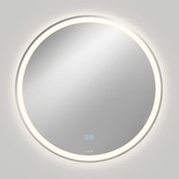 The Artika Ayla 28 in. LED mirror features a round, wall-mounted design with edge illumination, 3 CCT settings, and a built-in defogger. Two touch-sensitive icons are visible on the lower part, casting a soft glow on a plain gray wall.