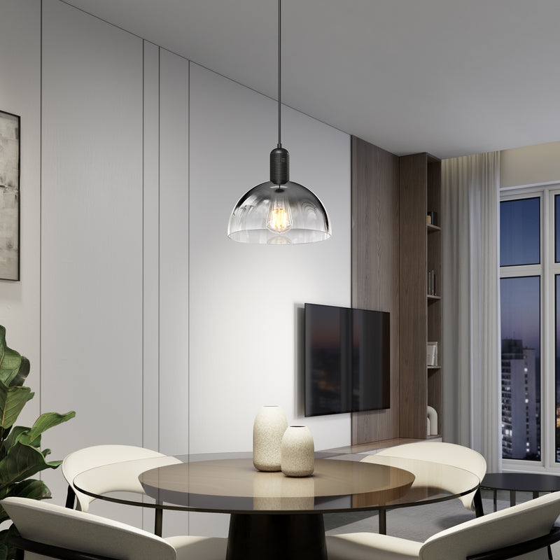 A modern dining area with a round table, four white chairs, two vases, a wall-mounted TV, large windows, neutral-tone decor, and the Artika Nella Pendant without Bulbs hanging overhead.