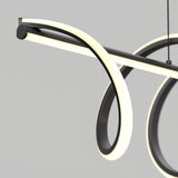 A modern, minimalist LED pendant light with black and white looping curves, suspended against a plain gray background. The design features flowing, illuminated bands creating an abstract, elegant shape.