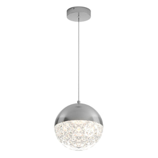 The Artika Carat LED pendant light 3 CCT features a modern round shade with half-metallic silver and half-textured clear glass, suspended by a thin cord from a circular silver ceiling mount.