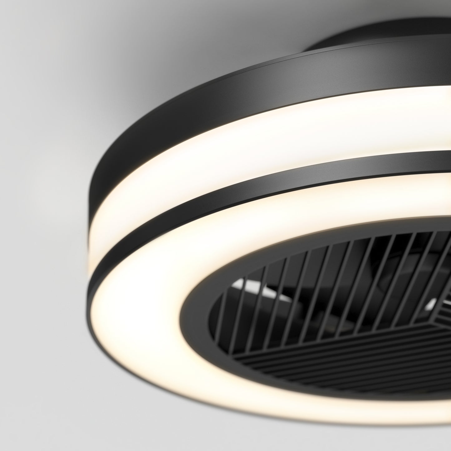The Artika Elton 19.4 in. LED modern ceiling fan features 3 speeds, a remote control, black blades visible through a central grille, and a sleek black and white design, all mounted on a white ceiling.