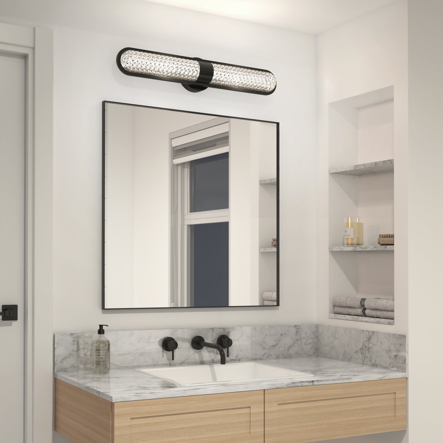 Modern bathroom with a marble countertop, rectangular mirror, wall-mounted black faucet, shelves for towels and toiletries, and the Artika Carat LED contemporary bathroom vanity light 3 CCT above the mirror.