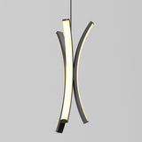 A modern pendant light with two curved, intersecting LED elements, one illuminated and one dark, suspended against a plain light gray background.