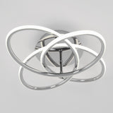Modern ceiling light fixture with intertwined chrome loops and integrated LED strips, creating an abstract, geometric design against a plain white background.