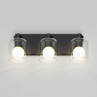 Artika Aryna 20 in. 3-Light LED Wall Vanity, black base, clear glass domes, glowing frosted bulbs, 3000K modern style.