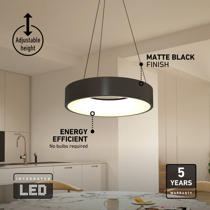 An Aiden LED pendant light hangs over a kitchen table as a round, matte black fixture with an adjustable height and energy-efficient lighting.