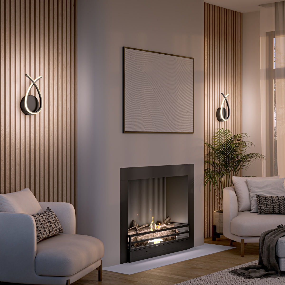 A modern living room with a black fireplace, abstract wall art, and two armchairs. Wooden slats decorate the walls, stylish wall sconces provide lighting, and a potted plant sits near a large window.