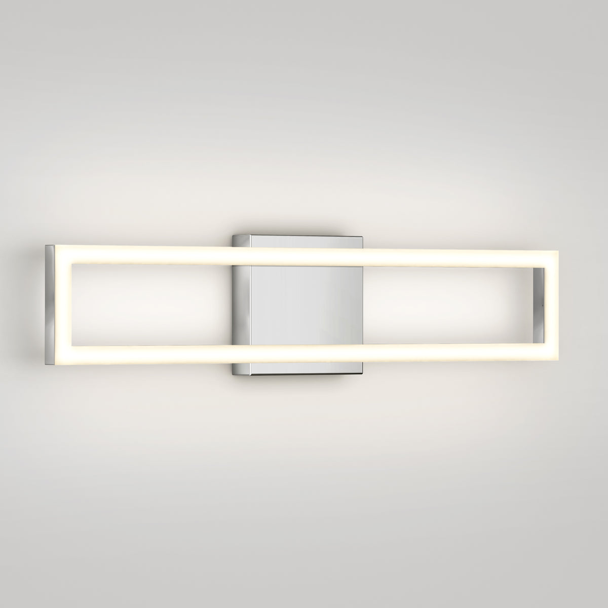 The Artika Dover modern LED bathroom vanity light 5 CCT features a rectangular metal base and a glowing rectangular LED frame, mounted horizontally on a plain light-colored wall for a sleek, contemporary look.