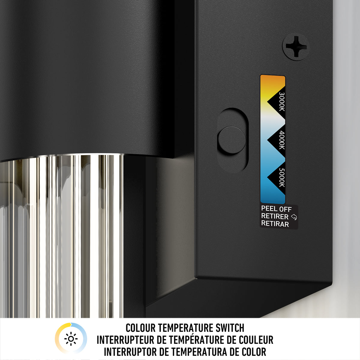 Close-up of the black adjustable color temperature switch on the Artika Dorado contemporary LED wall sconce, featuring a sliding selector for 3000K, 4000K, and 5000K. Below are labeled icons and instructions in English, French, and Spanish.