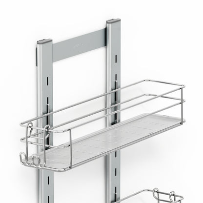 The Artika Camden Shower Caddy is a metal wall-mounted rack with a rectangular wire basket and hooks on two vertical rails, ideal for organizing items in kitchens or bathrooms. The product is shown against a white background.