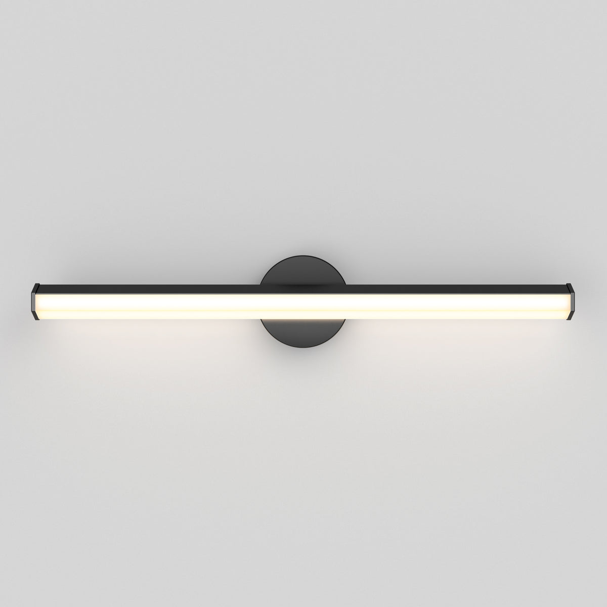 A modern, horizontal wall-mounted LED light fixture with a black circular base and a long, cylindrical white light bar, attached to a plain white wall.