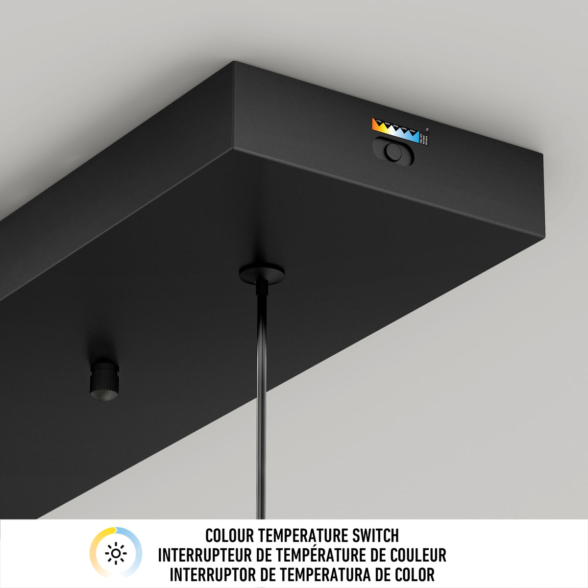 Close-up of the black Hanson 4-light LED pendant by Artika, featuring a color temperature switch and icon, suspended by two cables. Text below explains the 5 CCT switch in English, French, and Spanish.