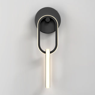 The Artika Catena modern LED wall sconce 5 CCT features a circular black base, an elongated oval frame, and a central vertical LED light bar, shown mounted on a plain light gray wall.