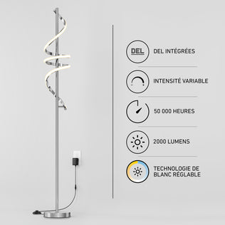 The Artika Coda modern LED floor lamp 5CCT stands by a wall featuring icons and French text about its integrated LEDs, adjustable white (5 CCT), 50,000-hour lifespan, 2000 lumens brightness, dimmable function, and minimalist design.