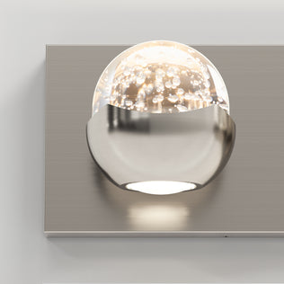 The Artika Oracle 4 light LED vanity fixture features dimmable bubble glass globes on a brushed metal rectangular plate.