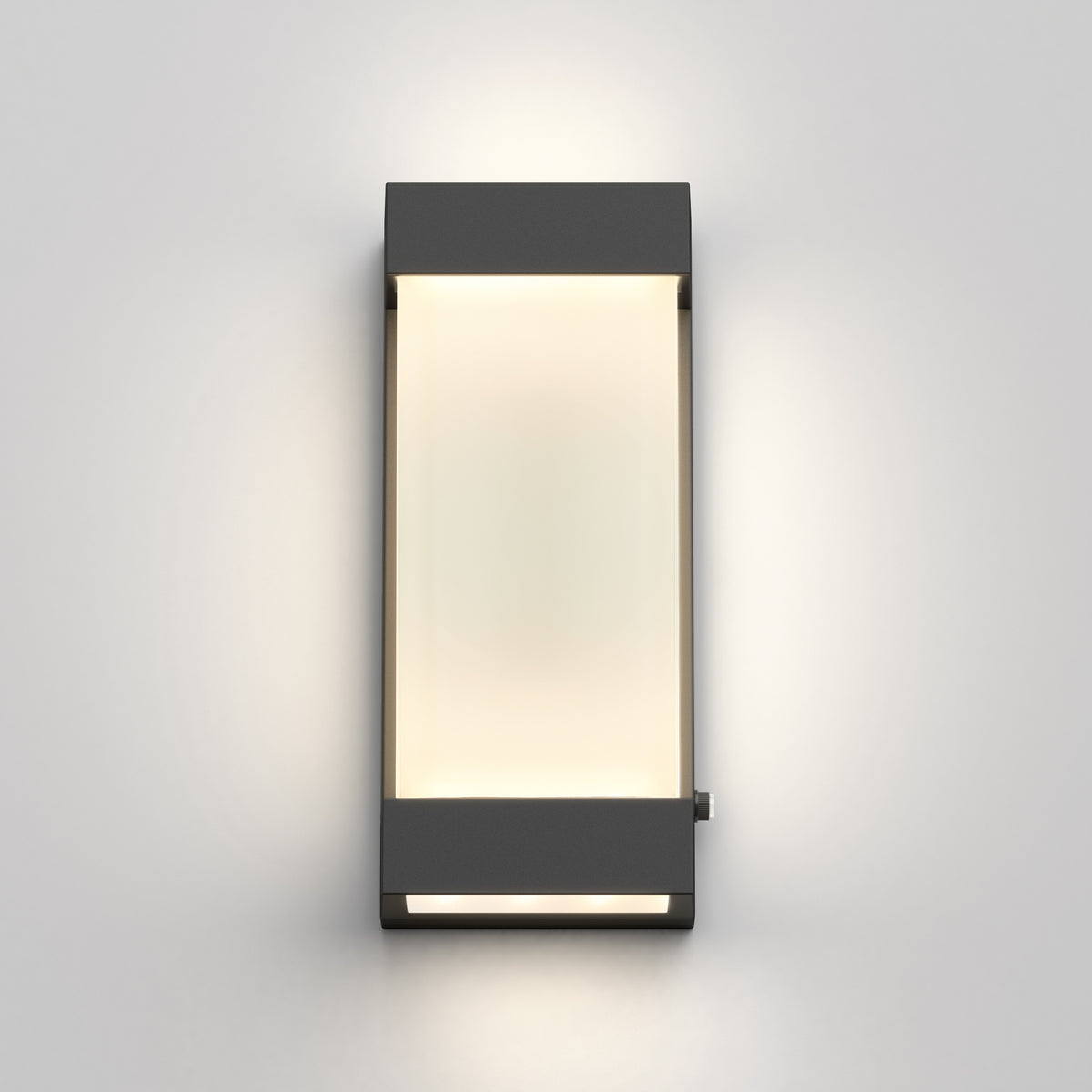 The Artika Glacier indoor-outdoor LED wall light features a modern rectangular design with a dark gray frame, casting a soft, even glow on any light-colored wall.