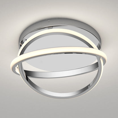 The Artika Orbia modern LED flush mount light 3 CCT features a round chrome base and two intersecting rings, one softly illuminated, for a sleek look on any neutral-colored ceiling.