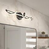 Modern bathroom with a rectangular mirror, marble-patterned wall tiles, and a unique black and white twisted LED wall light fixture above the mirror. A small wooden shelf holds a potted plant and decor items.