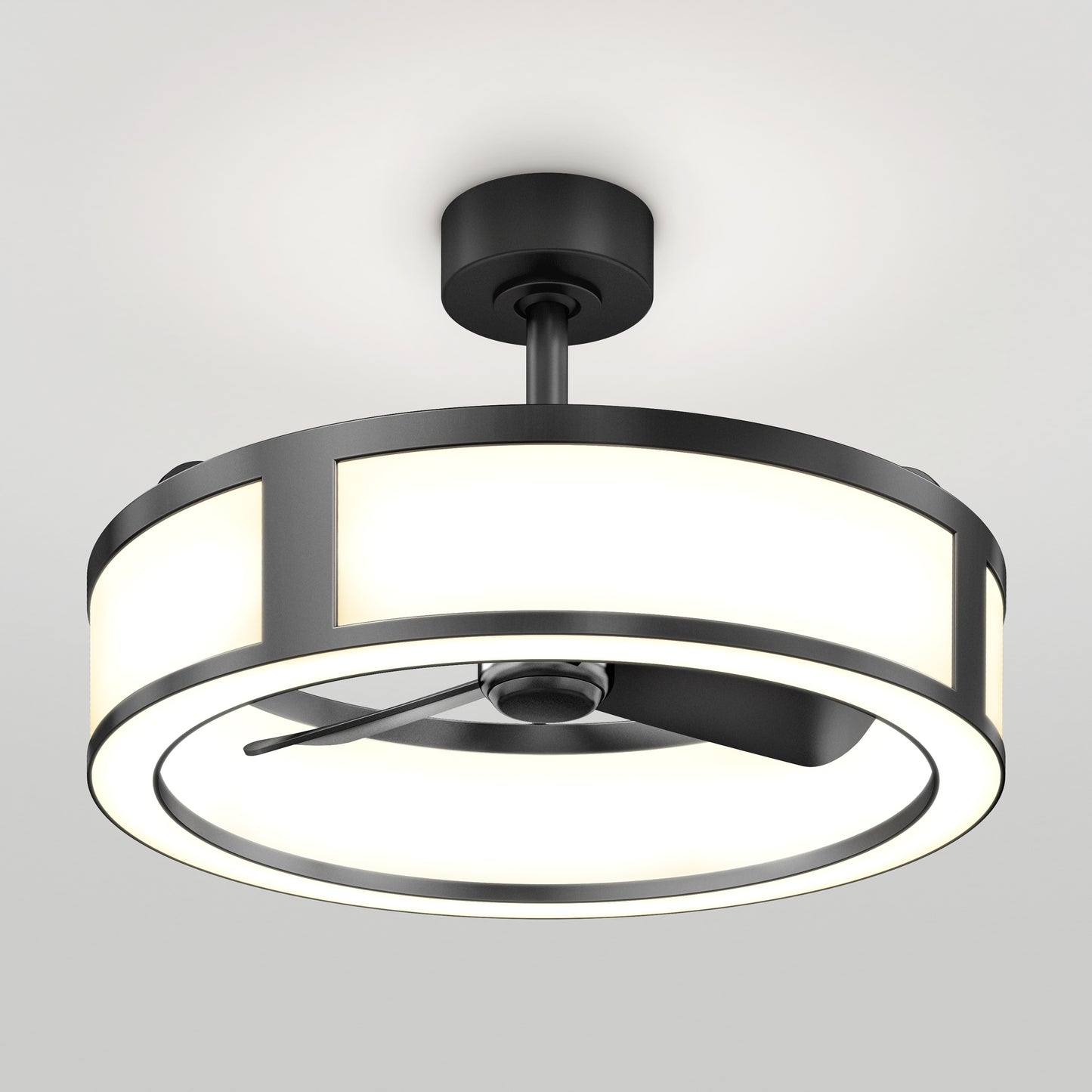The Artika Huxley 23 in. LED modern ceiling fan features three speeds, a circular LED light fixture, black metal accents, and fan blades enclosed within the illuminated ring, all mounted on a white ceiling.
