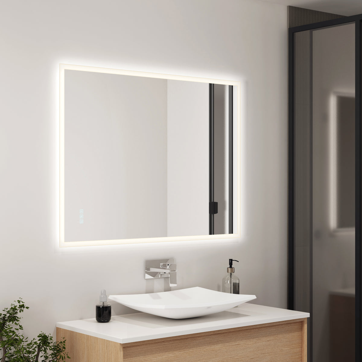 A modern bathroom features the Artika Mavis 48" x 36" rectangular LED mirror with defogger, a square white vessel sink on a wooden vanity, a chrome faucet, minimal accessories, and a plant in the corner.