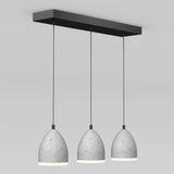 Three gray, dome-shaped pendant lights with a speckled concrete texture hang from a rectangular black ceiling mount against a plain white background.