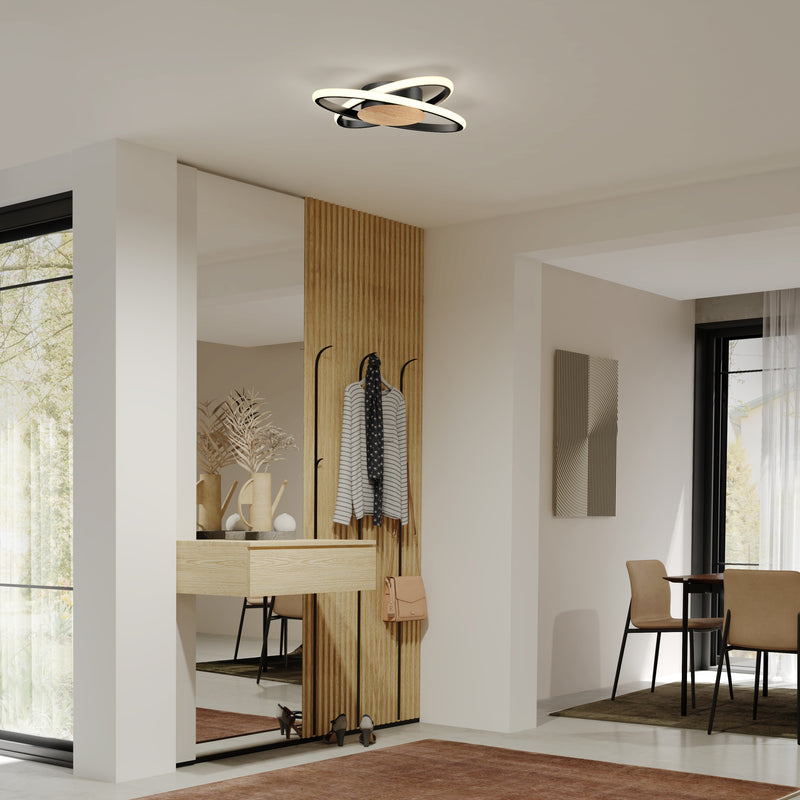 Modern entryway with wood accent wall, mirror, coat hooks, and Artika Atomic 15 in. LED flush mount 5 CCT; dining area beyond.