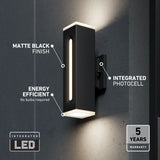 A modern black wall sconce with vertical LED lights is mounted on a gray wall. Text highlights its matte black finish, energy efficiency, integrated photocell, and 5-year warranty.